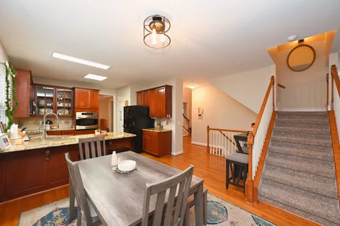 a bedroom with a bed and a flat tv screen on dresser