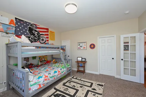 a bathroom with a sink a toilet and shower curtain