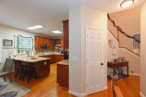 a view of kitchen island dining room cabinets and wooden floor