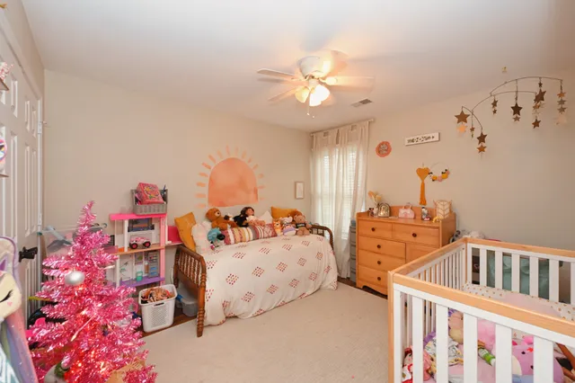 a bedroom with furniture and a chandelier