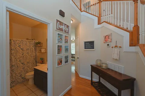 a living room with furniture a rug and a window