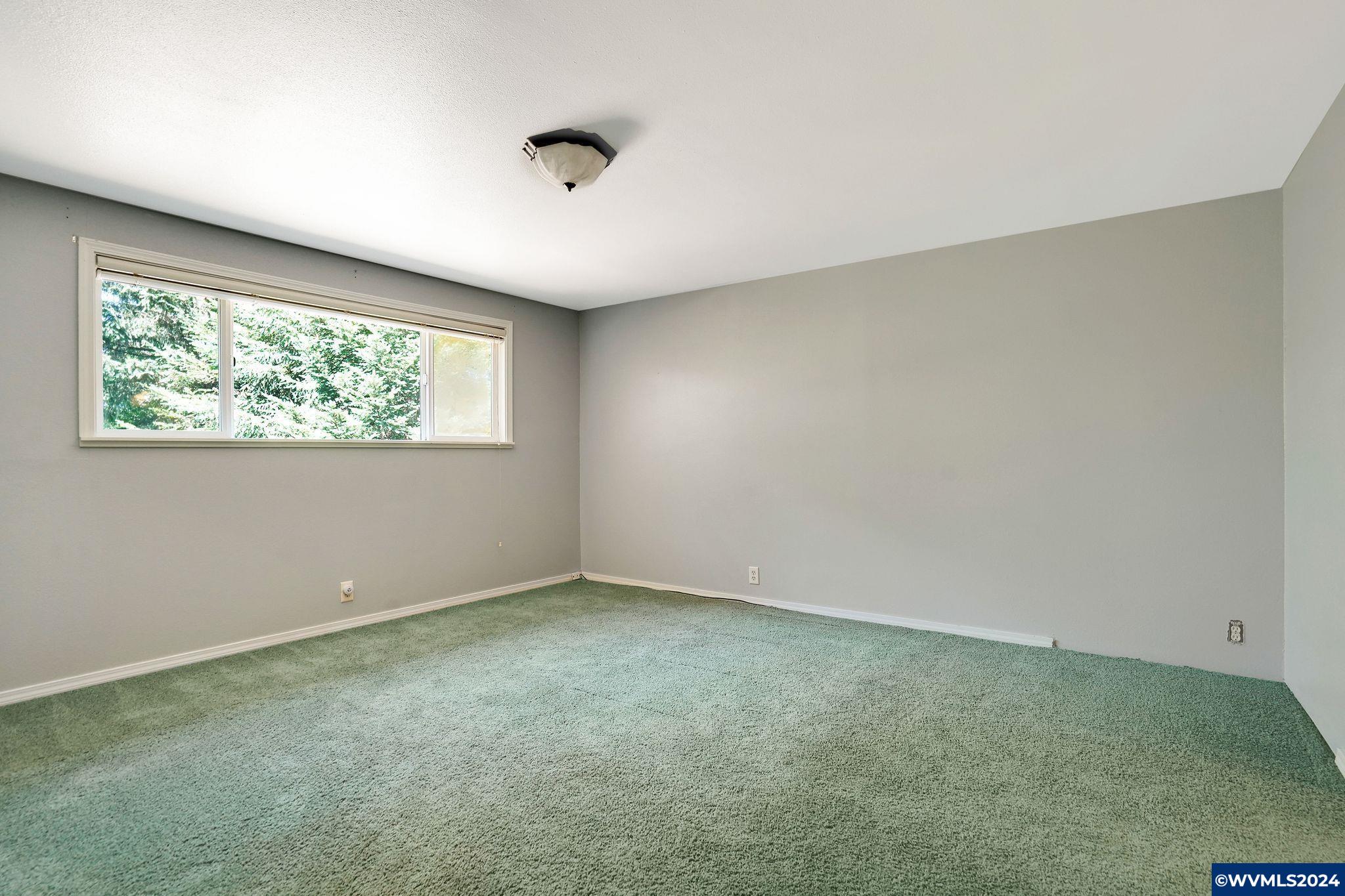 1787 Cochrane Lane Dallas, OR 97338 - Photo 6 of 42 an empty room with windows