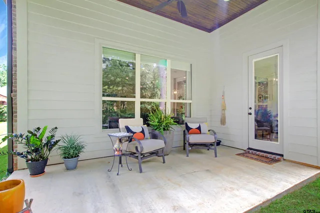 a outdoor living space with furniture and a potted plant