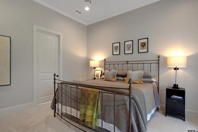 a bedroom with a bed and a mirror