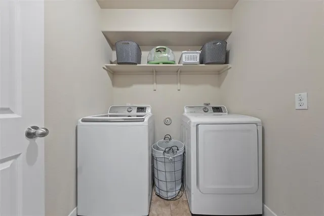 a utility room with dryer and washer