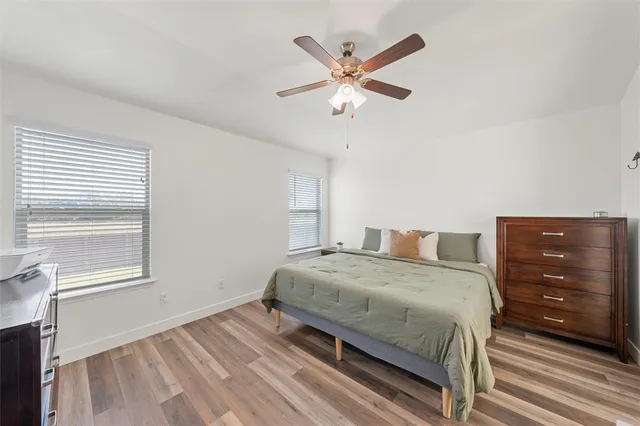 a bedroom with a bed and a dresser