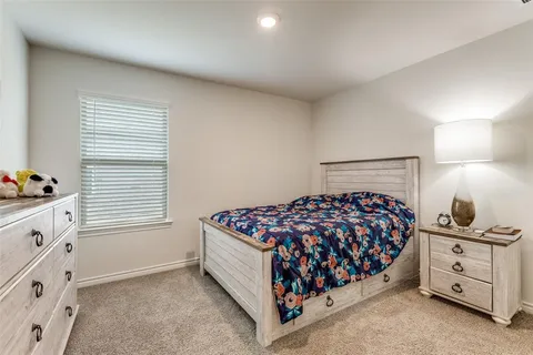a bed room with a bed and a window