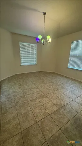 a view of a room with a chandelier