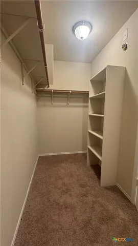 a view of room with walk in closet