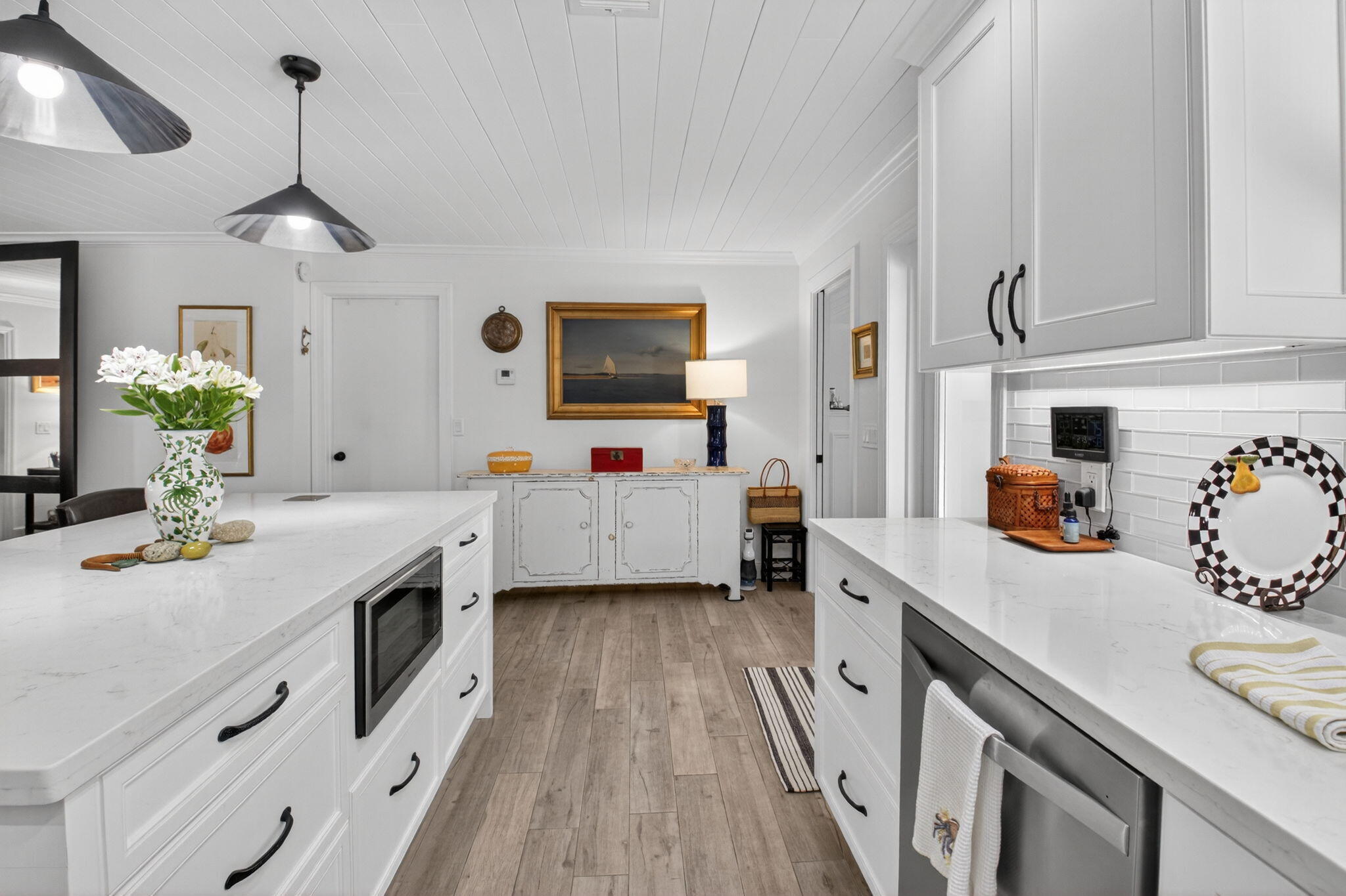 2702 Southwest 6th Street Boynton Beach, FL 33435 - Photo 15 of 49 a kitchen that has a lot of cabinets and wooden floor