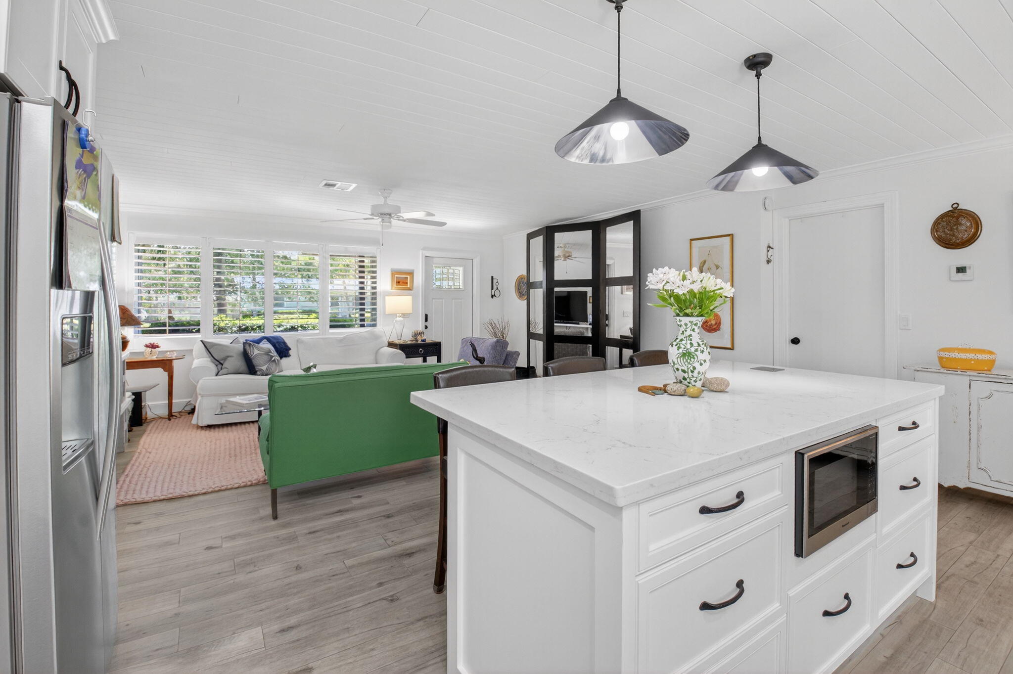 2702 Southwest 6th Street Boynton Beach, FL 33435 - Photo 16 of 49 a view of kitchen with windows and refrigerator
