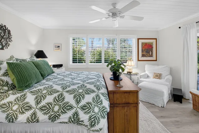 a bedroom with bed and window