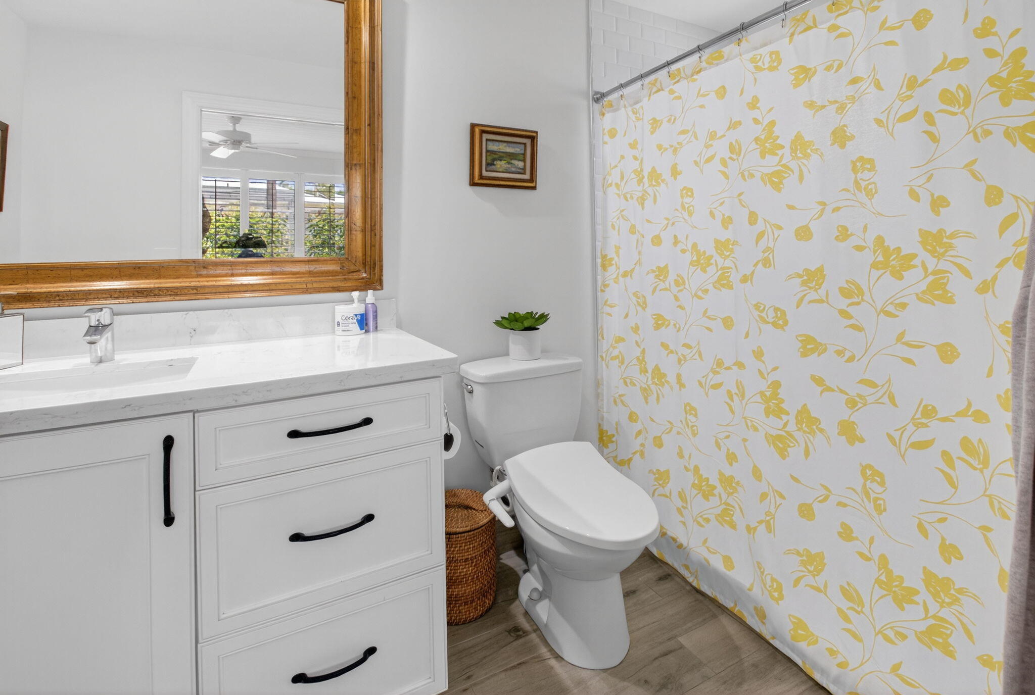 2702 Southwest 6th Street Boynton Beach, FL 33435 - Photo 23 of 49 a bathroom with a granite countertop toilet sink and mirror