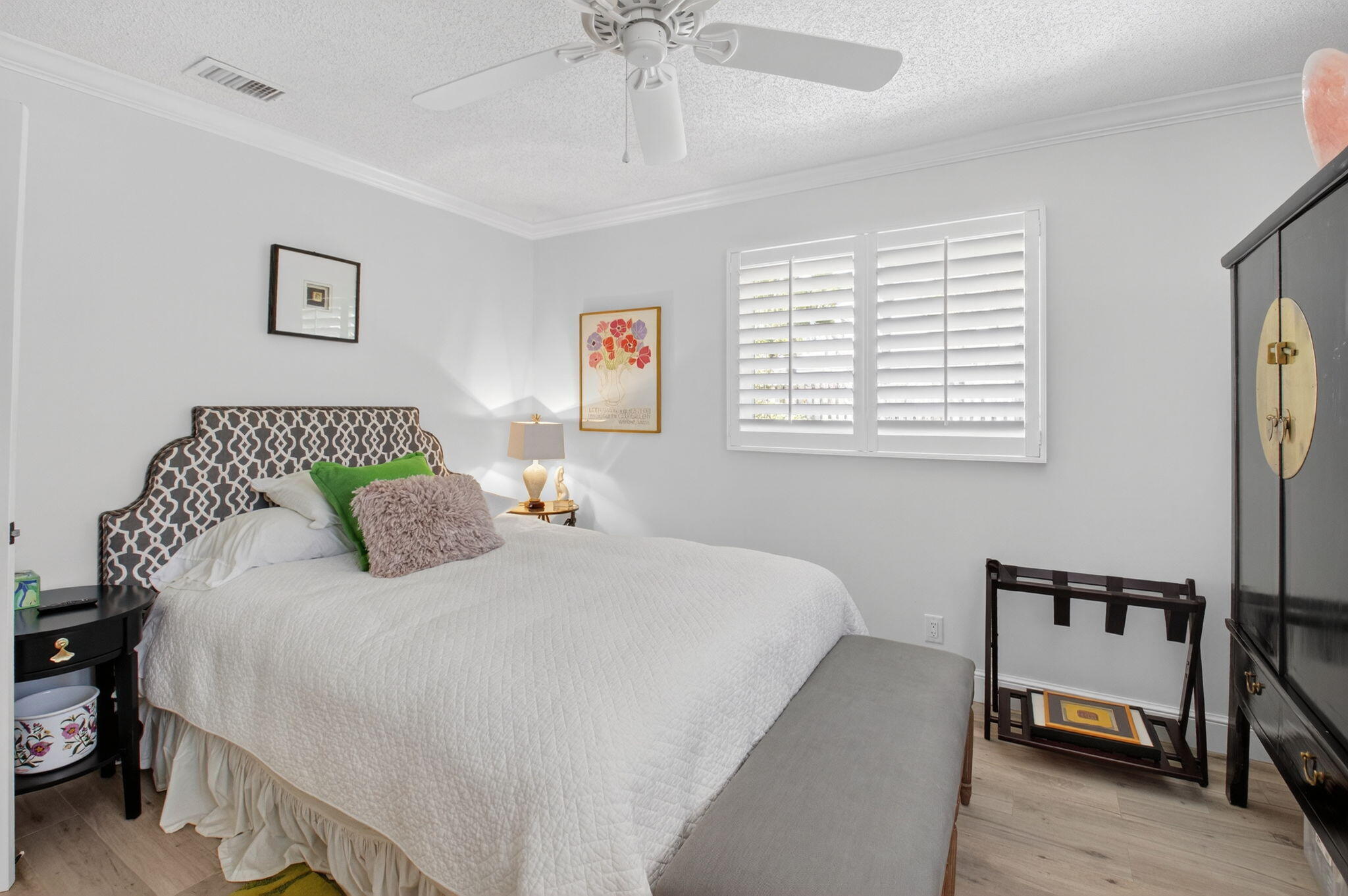 2702 Southwest 6th Street Boynton Beach, FL 33435 - Photo 27 of 49 a bedroom with a bed and a chandelier