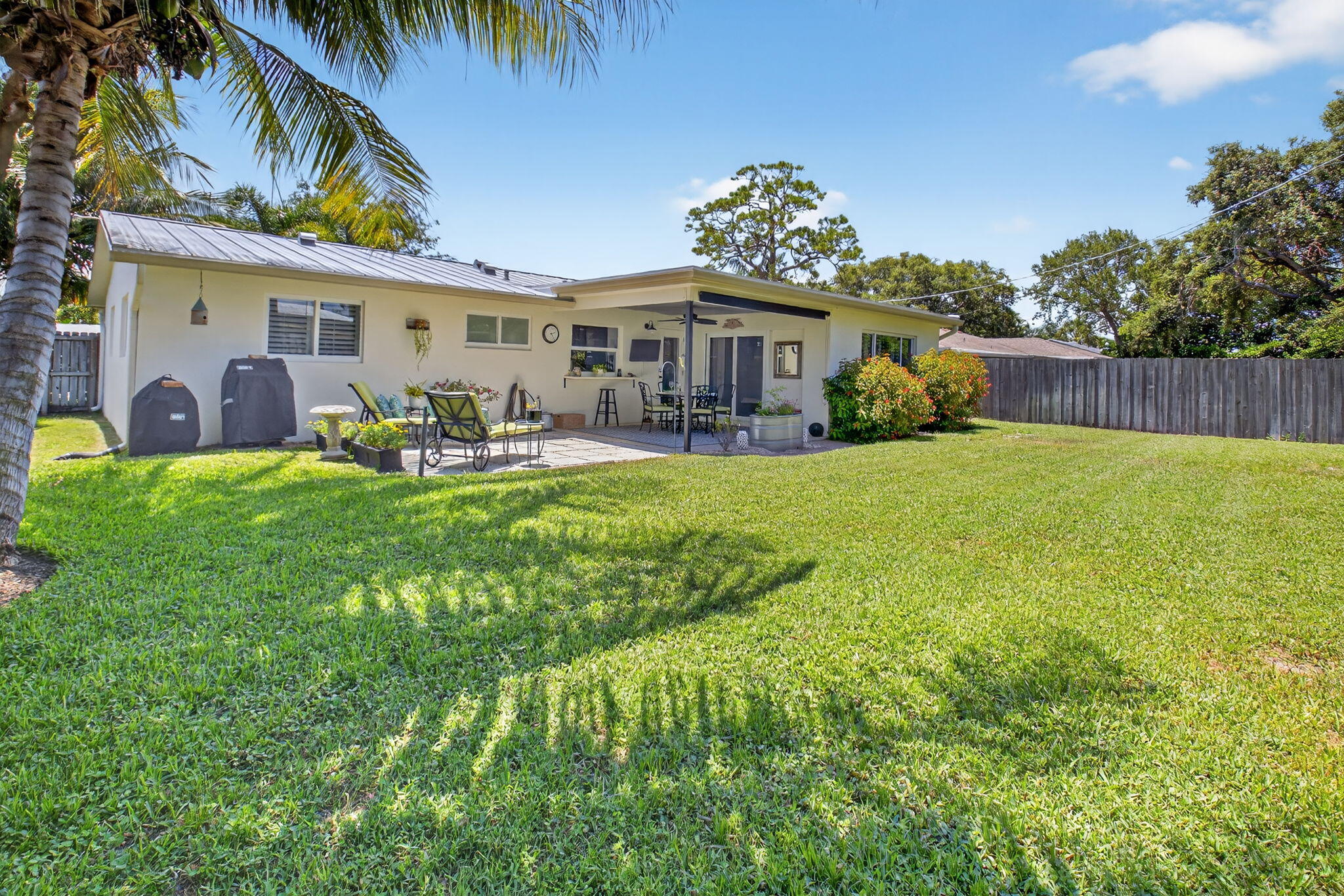 2702 Southwest 6th Street Boynton Beach, FL 33435 - Photo 36 of 49 a view of a house with a yard patio and sitting area