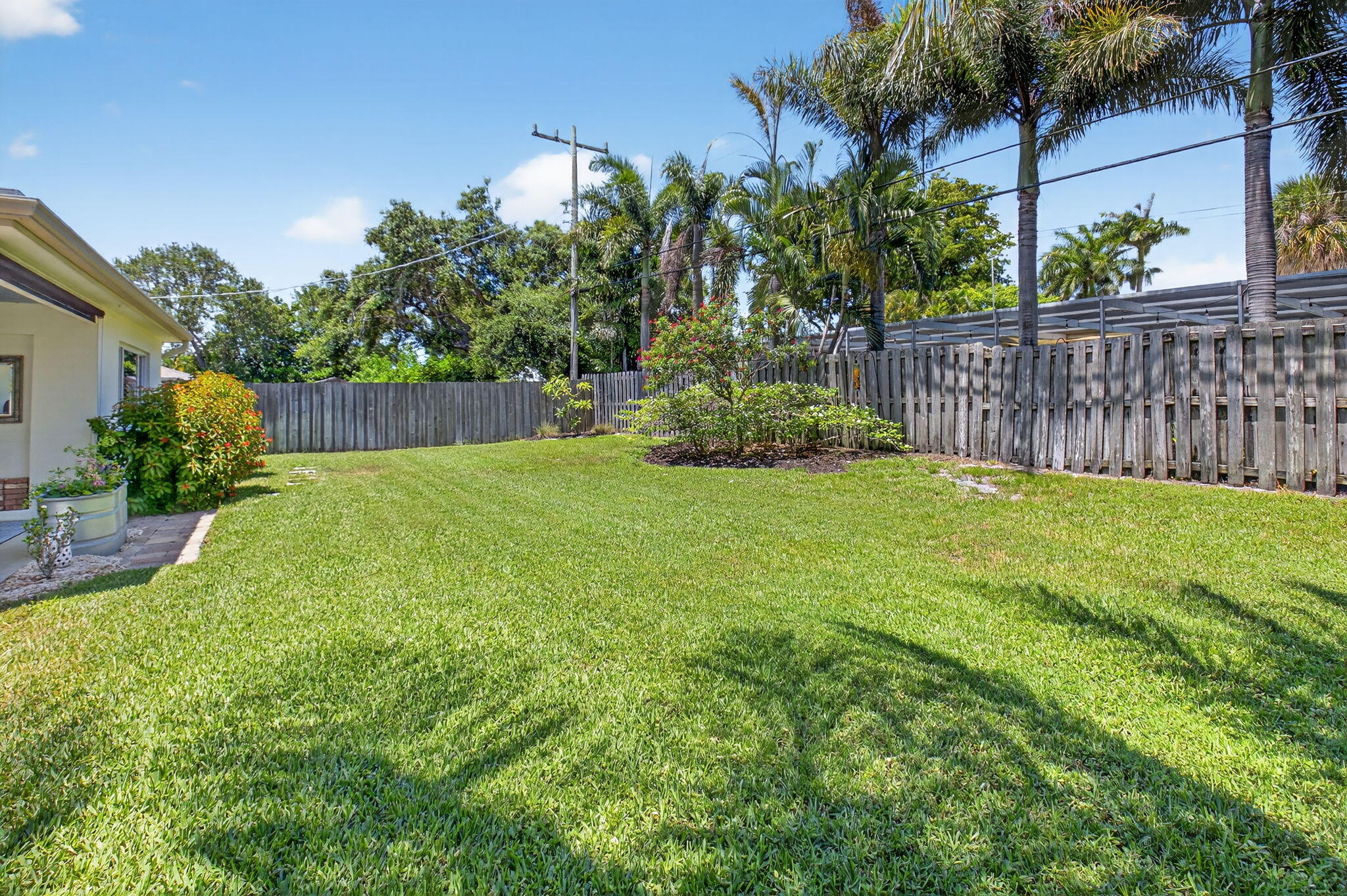 2702 Southwest 6th Street Boynton Beach, FL 33435 - Photo 38 of 49 a view of a backyard with a garden
