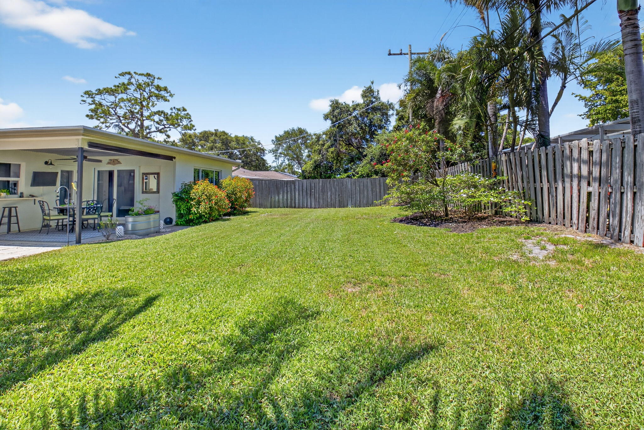 2702 Southwest 6th Street Boynton Beach, FL 33435 - Photo 39 of 49 a view of a house with porch and garden