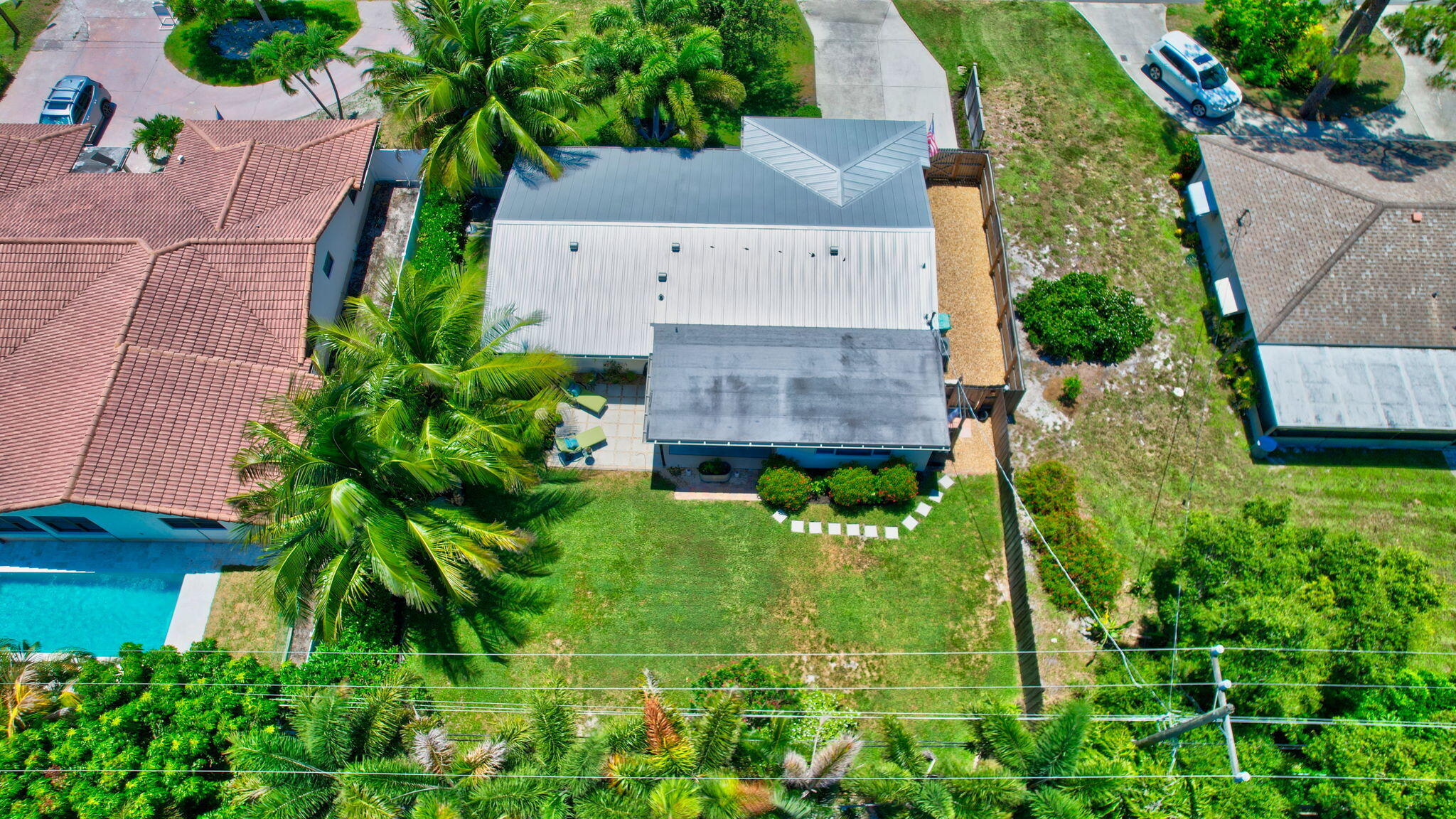2702 Southwest 6th Street Boynton Beach, FL 33435 - Photo 46 of 49 an aerial view of a house with a yard and large trees