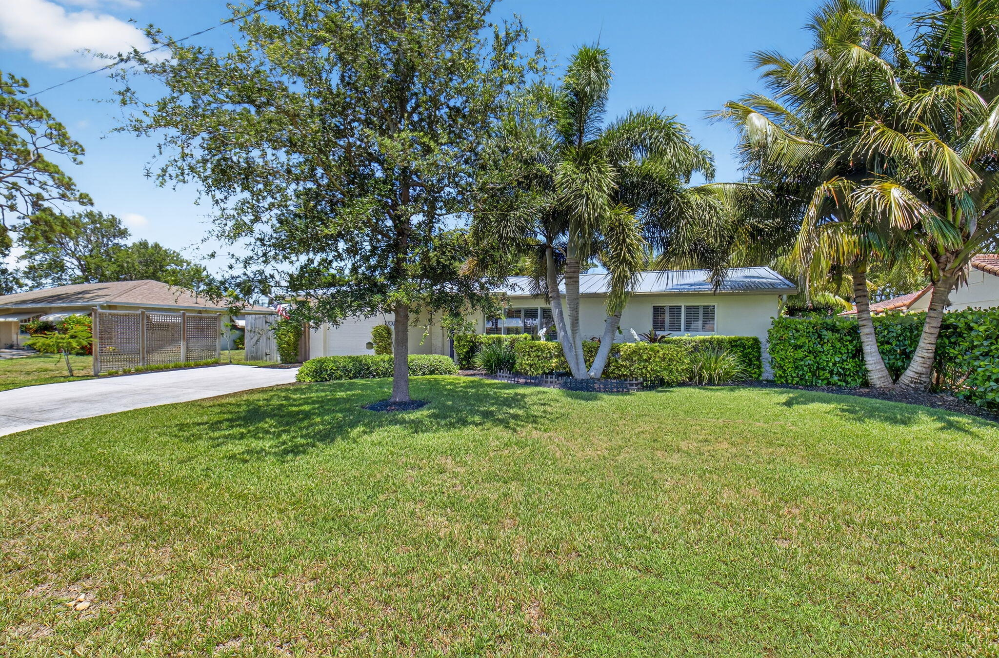 2702 Southwest 6th Street Boynton Beach, FL 33435 - Photo 48 of 49 a view of a house with a big yard plants and large trees