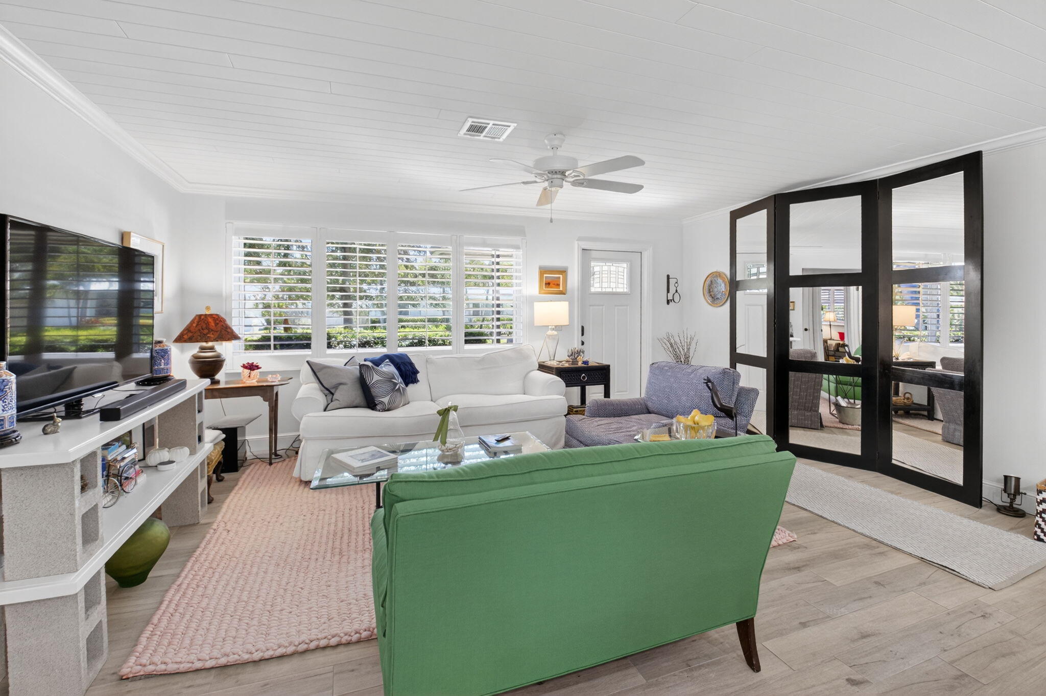 2702 Southwest 6th Street Boynton Beach, FL 33435 - Photo 7 of 49 a living room with furniture large windows and flat screen tv