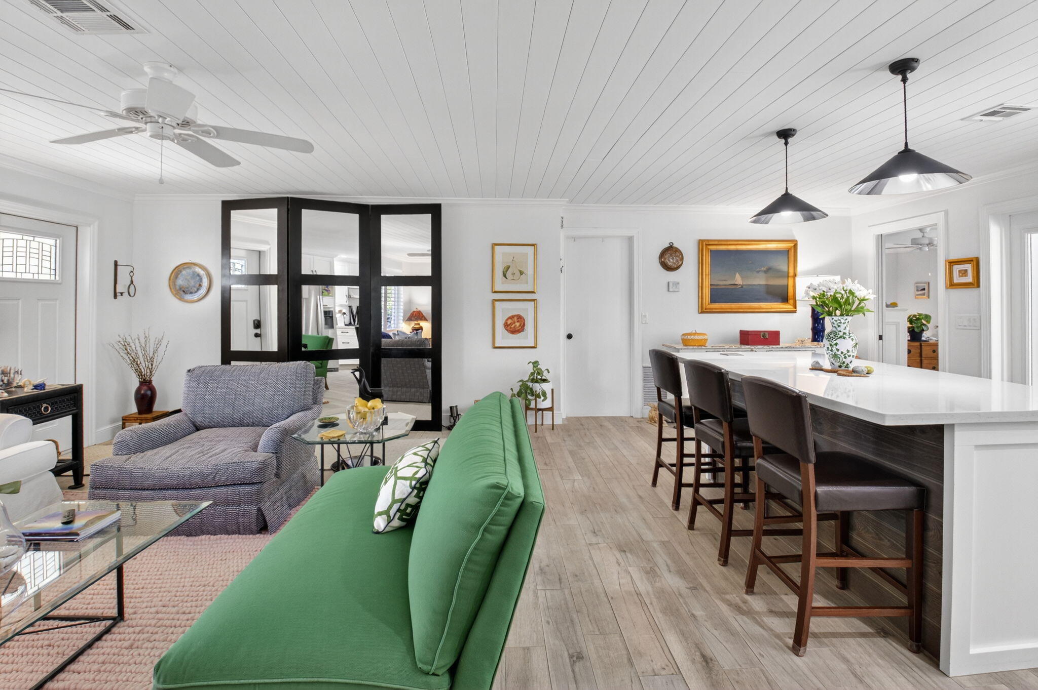 2702 Southwest 6th Street Boynton Beach, FL 33435 - Photo 8 of 49 a living room with furniture dining table and a chandelier
