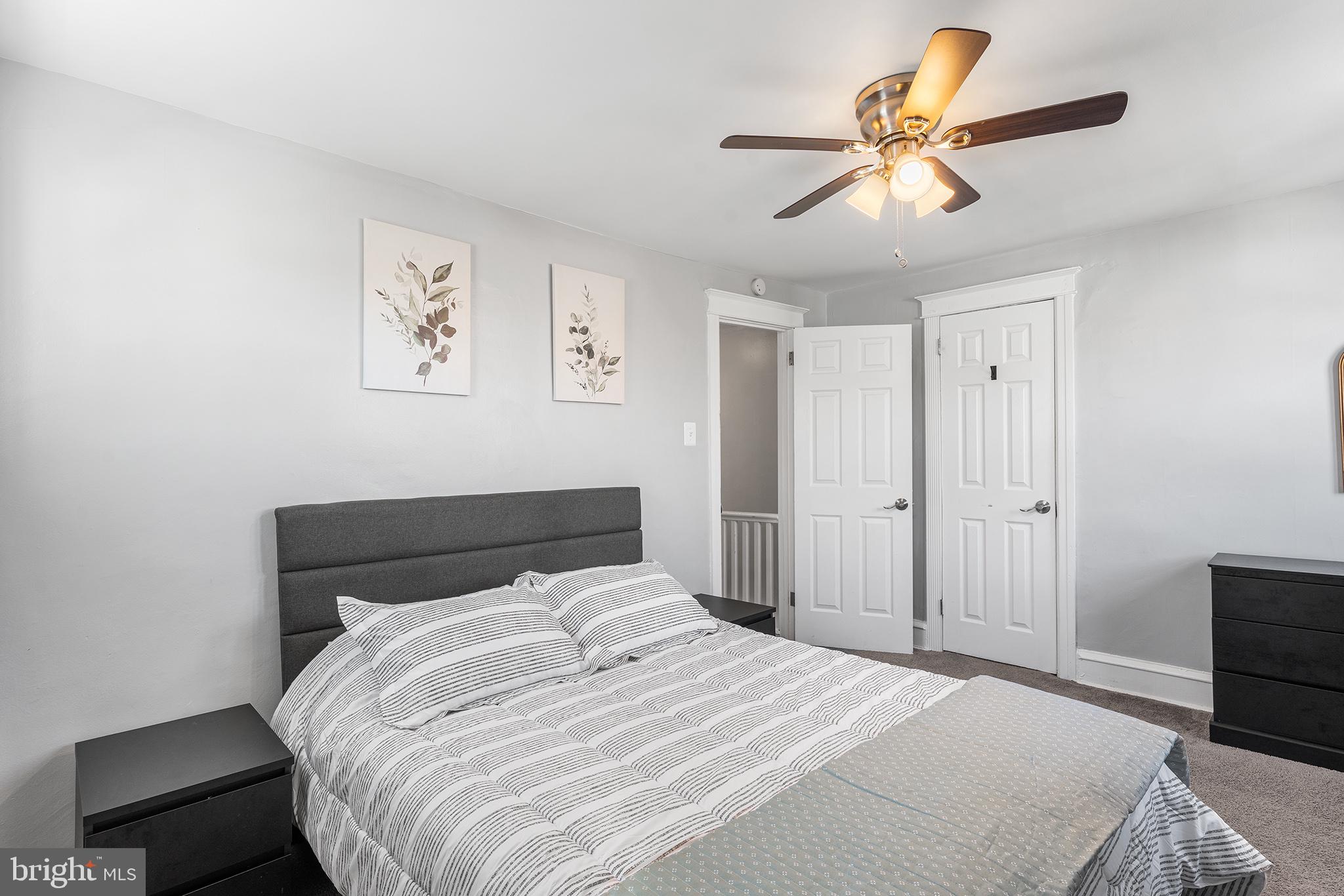 424 Cypress Street Lansdowne, PA 19050 - Photo 20 of 32 a bedroom with a large bed and a ceiling fan