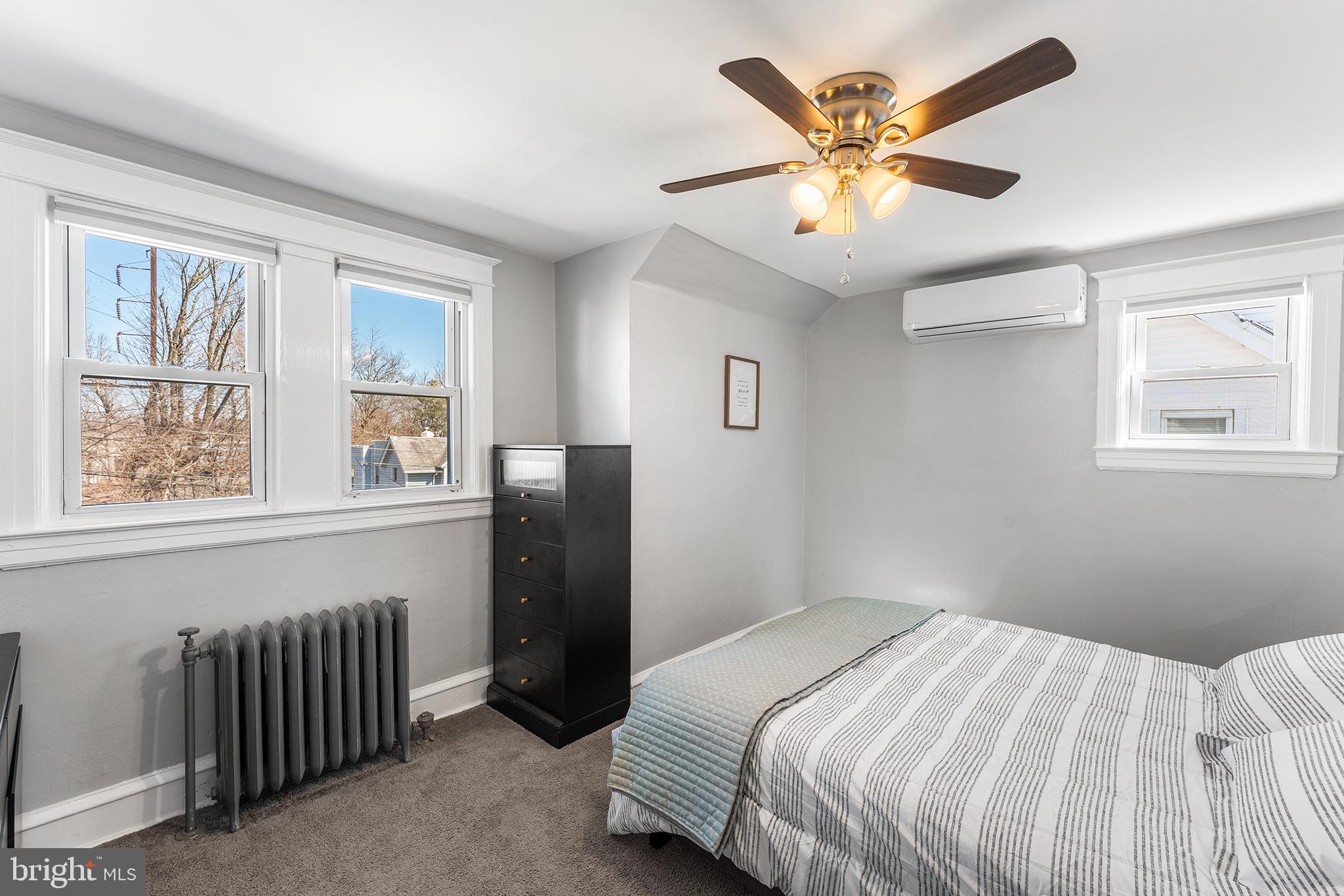 424 Cypress Street Lansdowne, PA 19050 - Photo 22 of 32 a bedroom with a bed and a large window