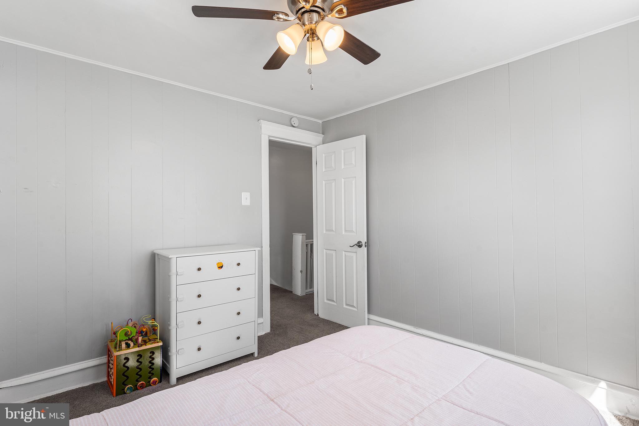 424 Cypress Street Lansdowne, PA 19050 - Photo 24 of 32 a bedroom with a bed and a ceiling fan