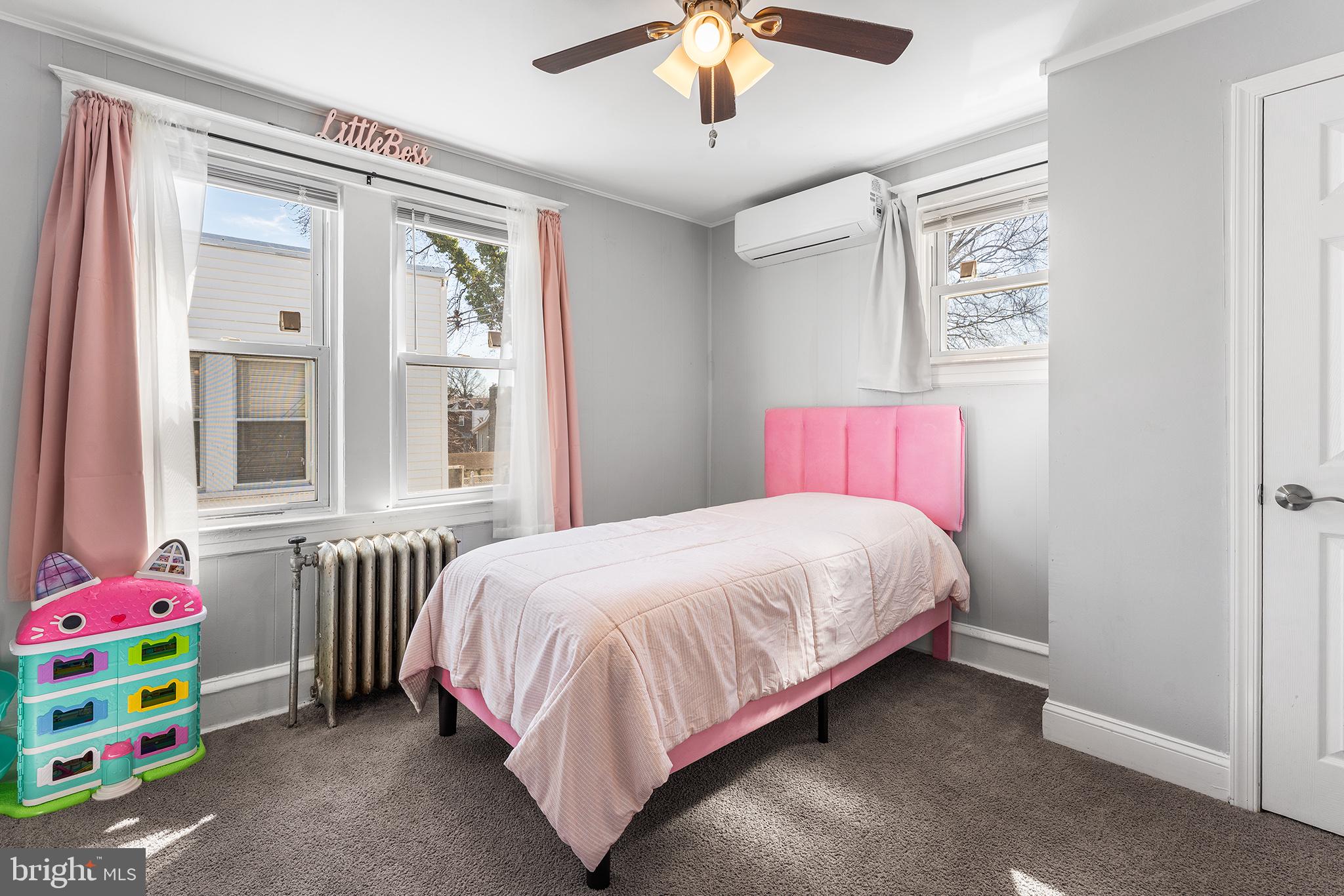 424 Cypress Street Lansdowne, PA 19050 - Photo 25 of 32 a bedroom with a bed and a chandelier
