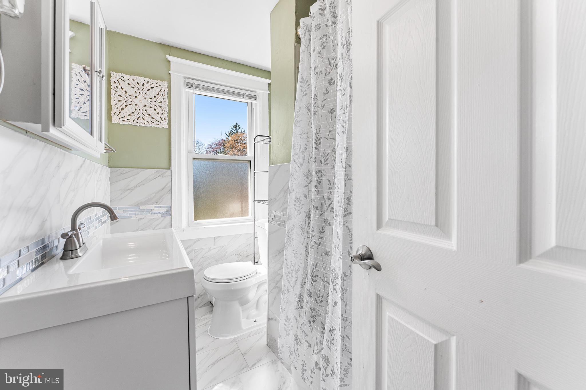 424 Cypress Street Lansdowne, PA 19050 - Photo 26 of 32 a bathroom with a sink and toilet