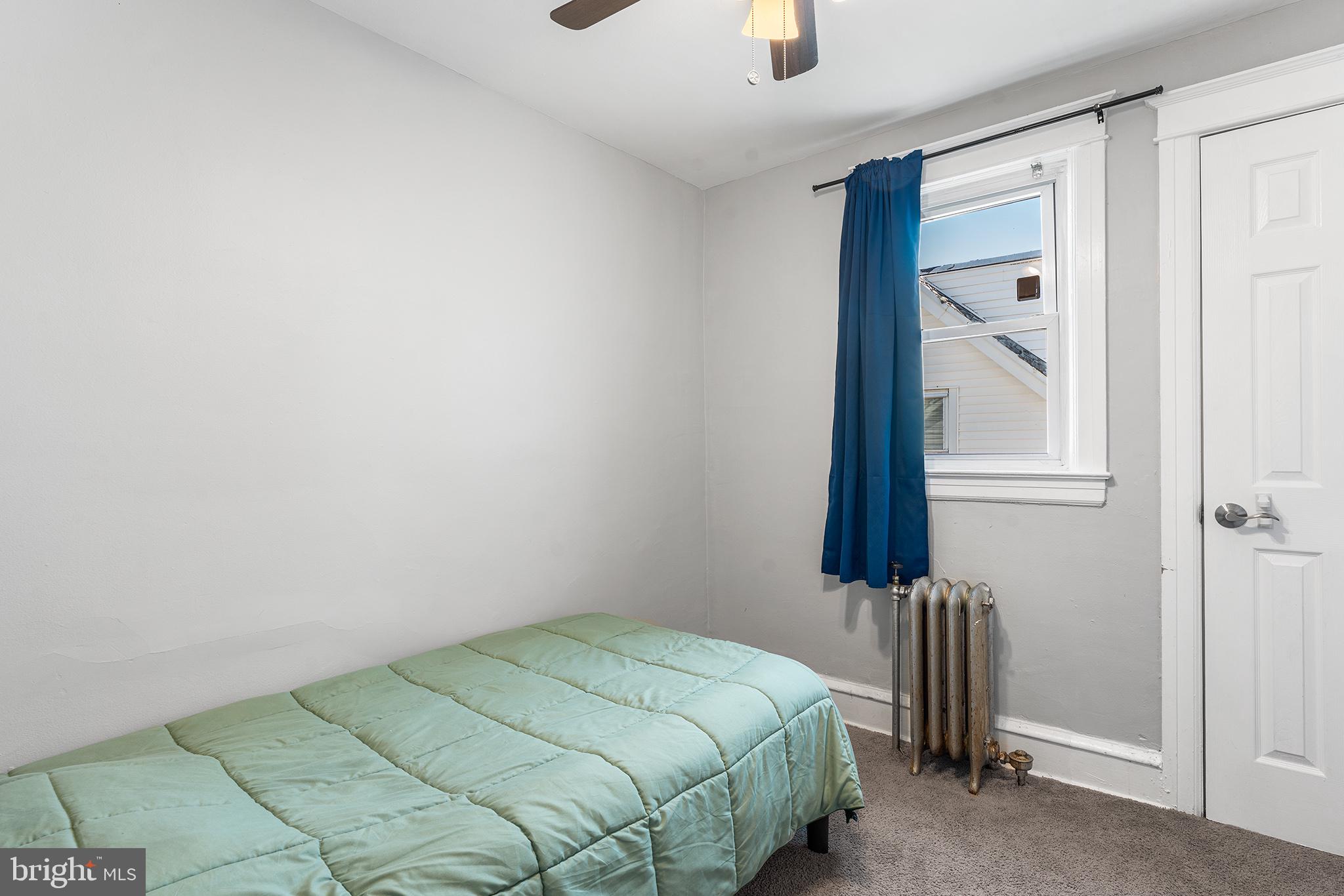 424 Cypress Street Lansdowne, PA 19050 - Photo 27 of 32 a bedroom with a bed and a window