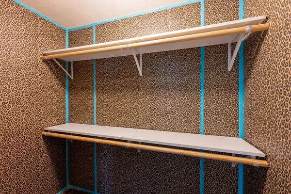 an aerial view of residential house with outdoor space and trees all around