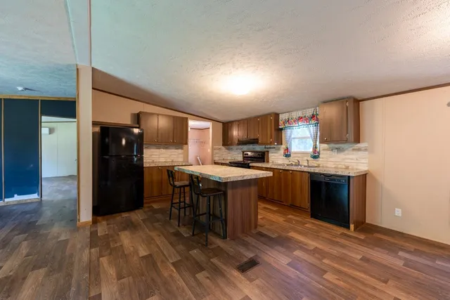 a view of a empty room with a fireplace