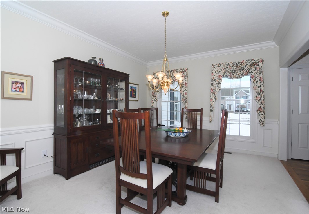 659 Sunridge Road Fairlawn, OH 44333 - Photo 3 of 35 Formal dining room with crown molding and wainscoating