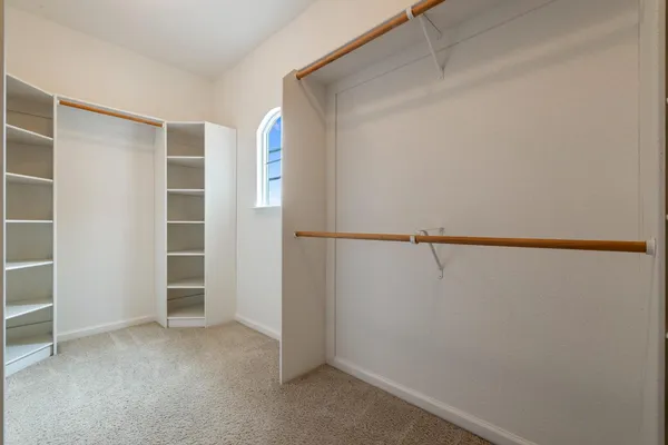 a view of an empty walk in closet