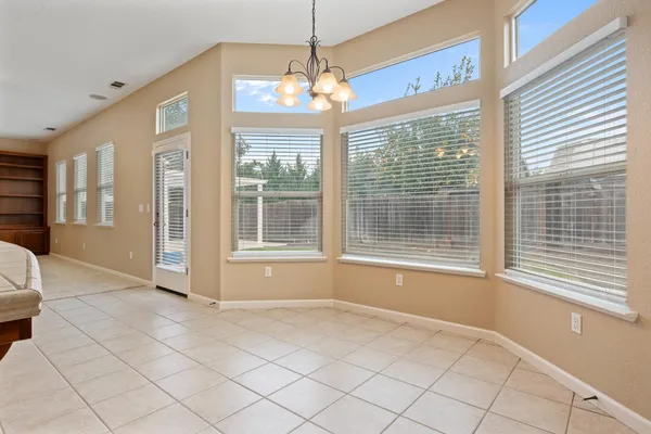 a kitchen with stainless steel appliances granite countertop a refrigerator a sink and a stove