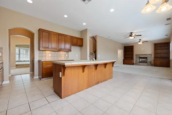 wooden floor fireplace and windows in a room