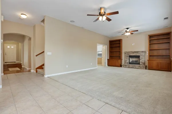 a view of a kitchen with a sink and a refrigerator