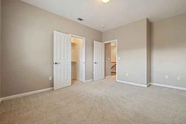 a view of a hallway with staircase