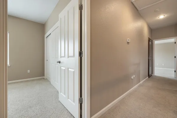 a en suite bathroom with a double vanity sink and a mirror