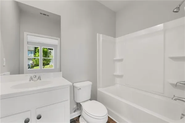 a bathroom with a sink toilet and bathtub
