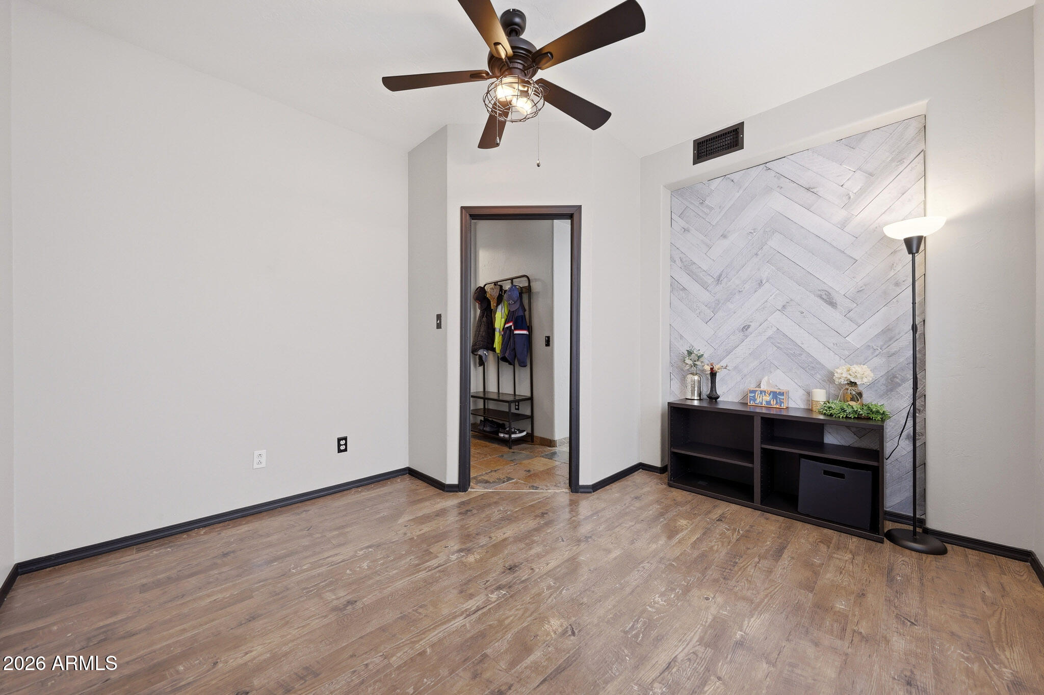 2167 East Nighthawk Way Phoenix, AZ 85048 - Photo 7 of 28 wooden floor in an empty room