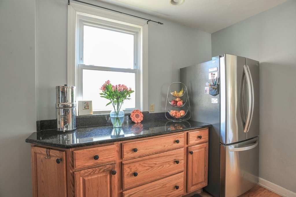 12 L Street Hull, MA 02045 - Photo 12 of 29 a counter with refrigerator and window