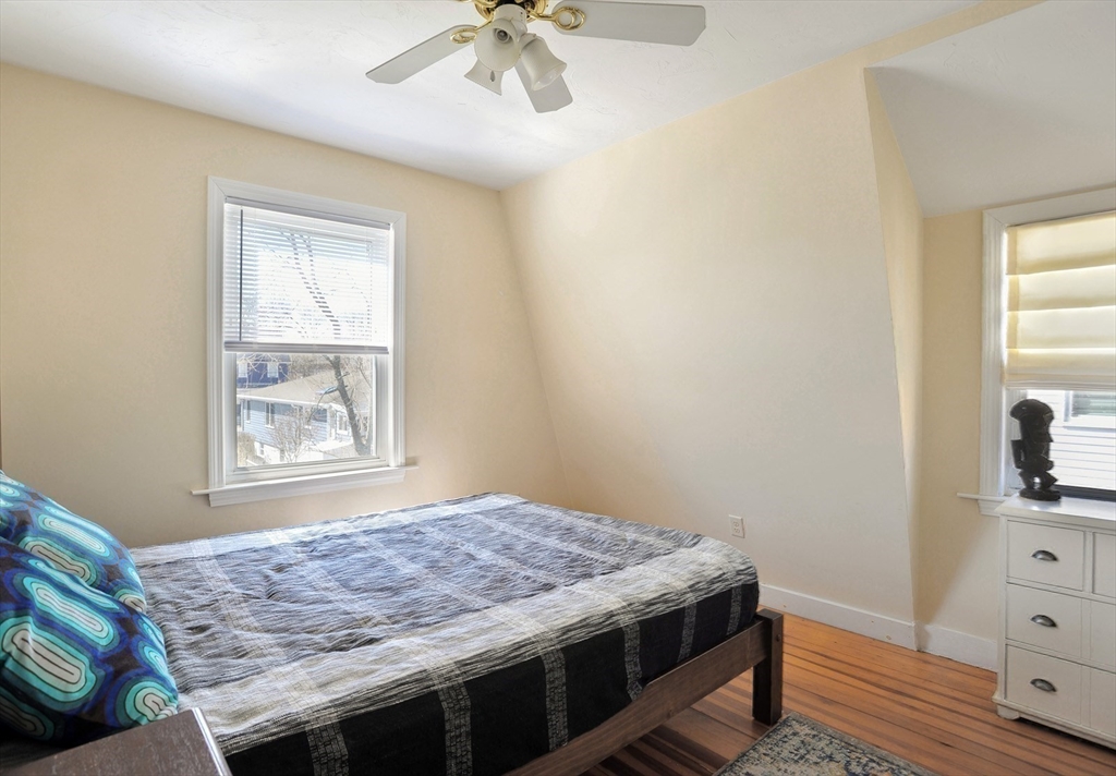 12 L Street Hull, MA 02045 - Photo 15 of 29 a bedroom with a bed and a dresser in it