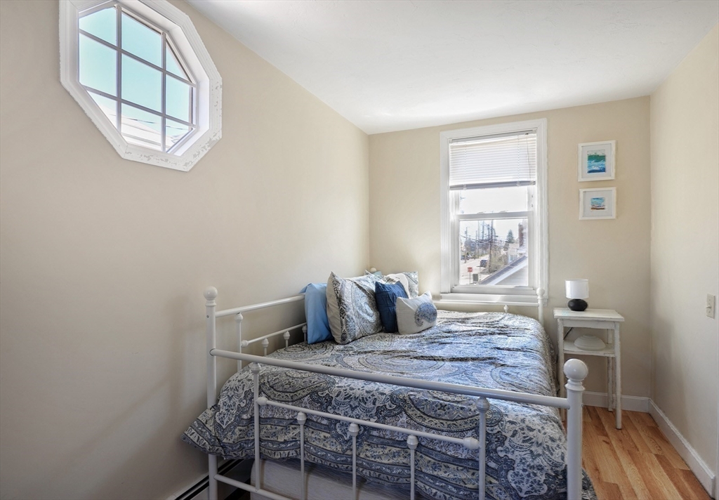 12 L Street Hull, MA 02045 - Photo 16 of 29 a bedroom with a bed and wooden floor