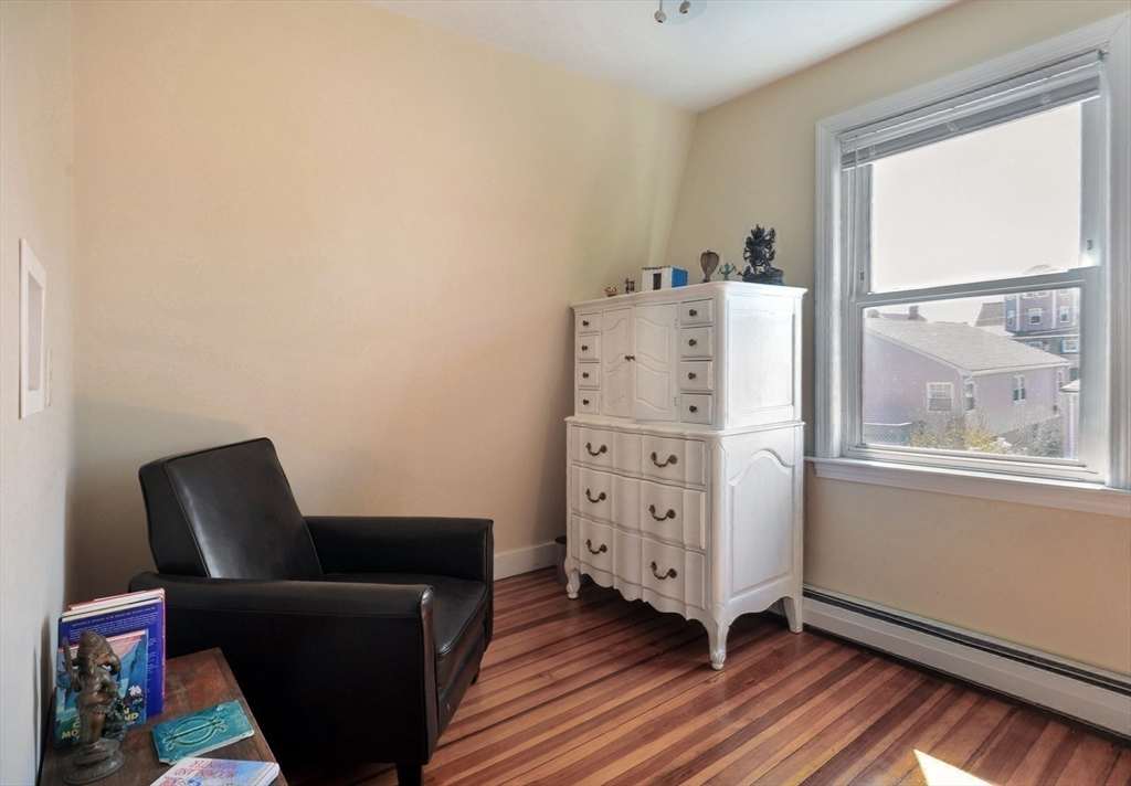 12 L Street Hull, MA 02045 - Photo 19 of 29 a room with furniture and wooden floor
