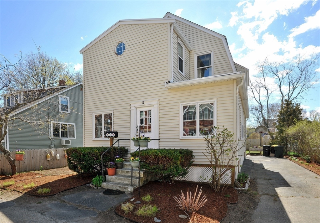 12 L Street Hull, MA 02045 - Photo 24 of 29 a front view of a house with a yard