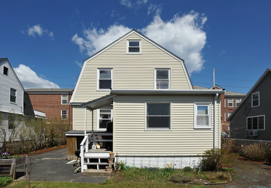 12 L Street Hull, MA 02045 - Photo 25 of 29 a front view of a house with a yard