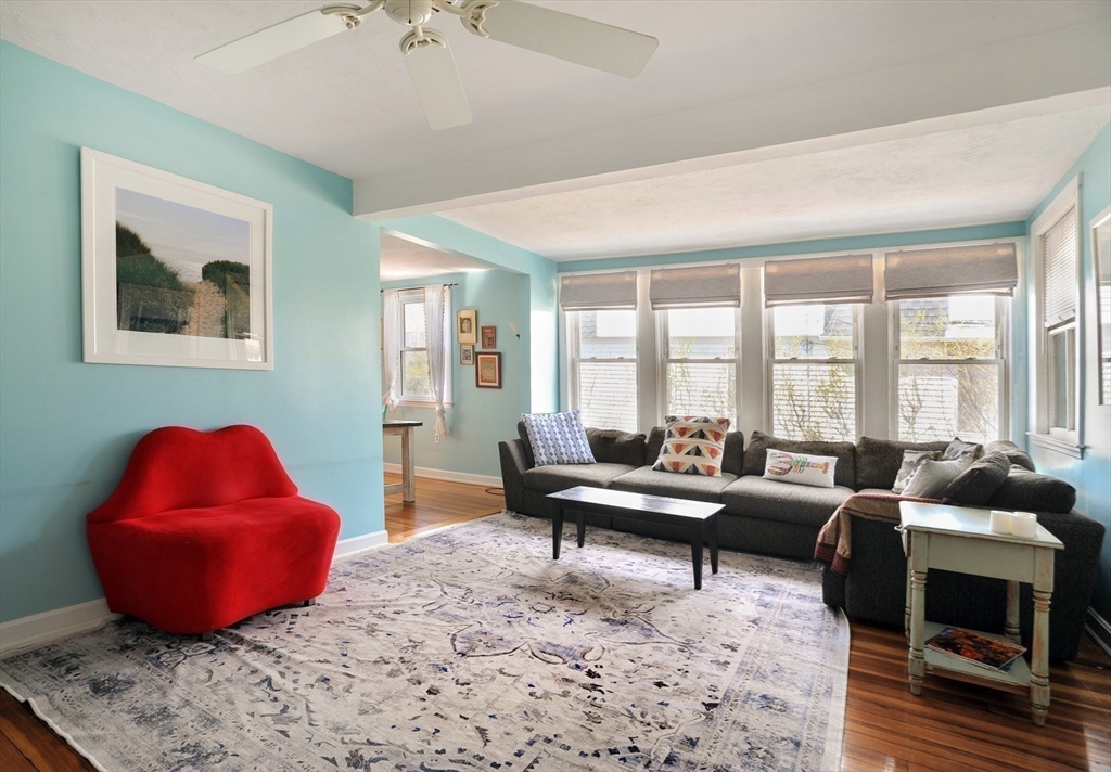 12 L Street Hull, MA 02045 - Photo 3 of 29 a living room with furniture a rug and a large window