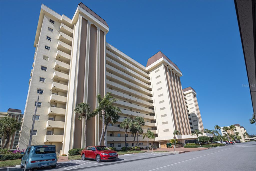4575 Cove Circle, Unit 1105 St. Petersburg, FL 33708 - Photo 1 of 1 a front view of building with yard